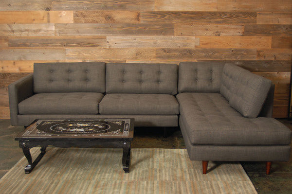 grey sofa and a coffee table on a patterned rug