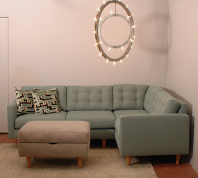 decorative light fixture hanging above a sofa and ottoman