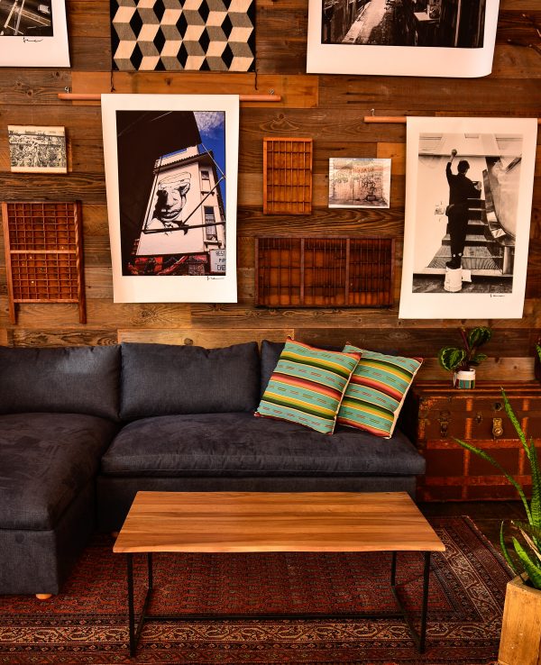 Navy blue sofa in a living room with decor