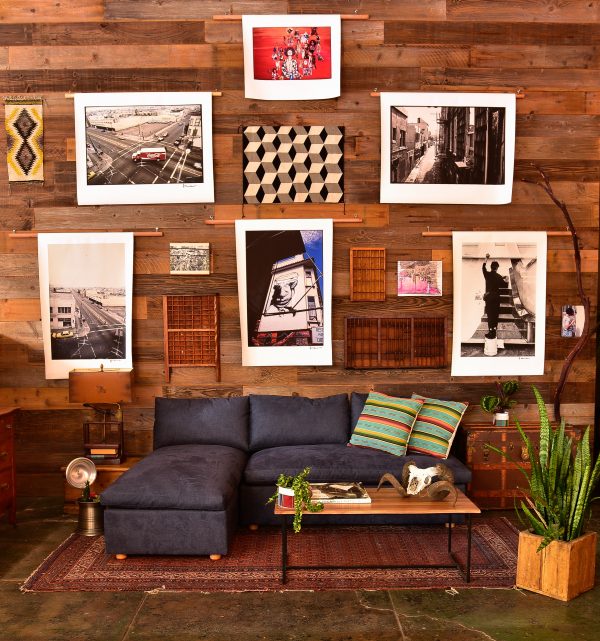 Navy blue sofa in a living room with decor and plants