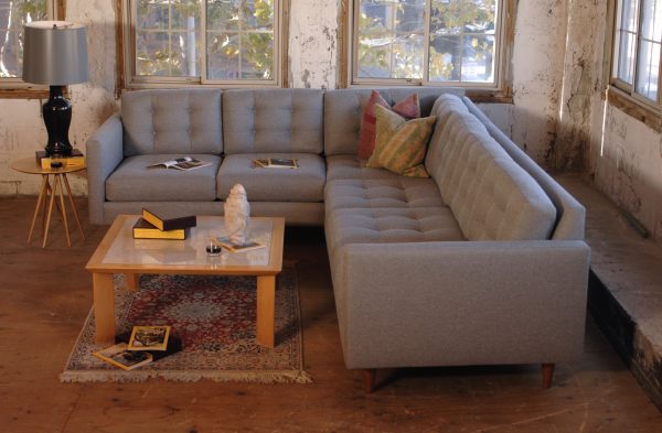 Grey sofa in living room with decor