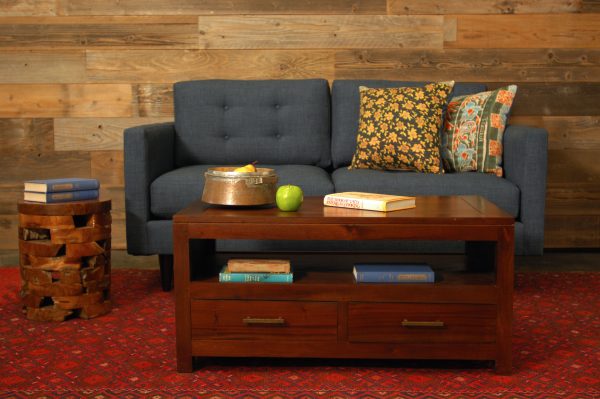 Blue sofa in living room with furniture and decor