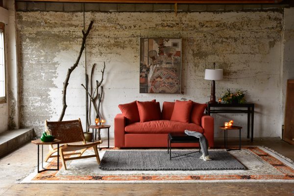 Red sofa in living room with decor