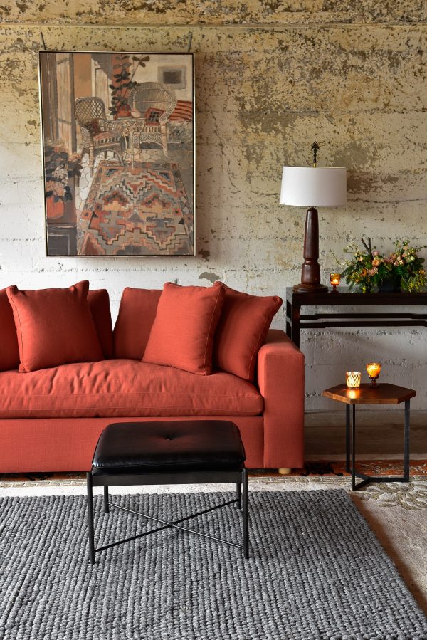 Red sofa in living room with decor