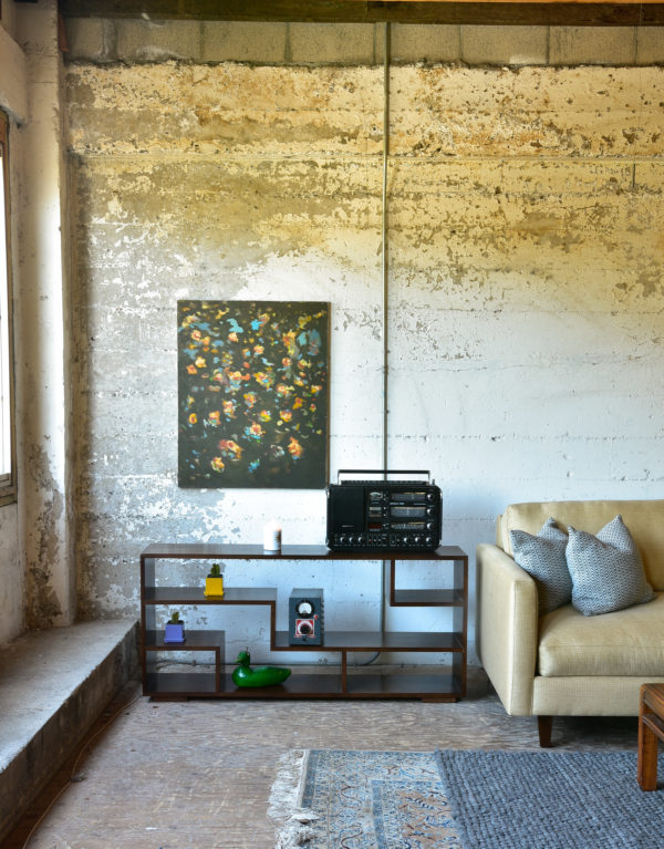 wood console in living room with decor