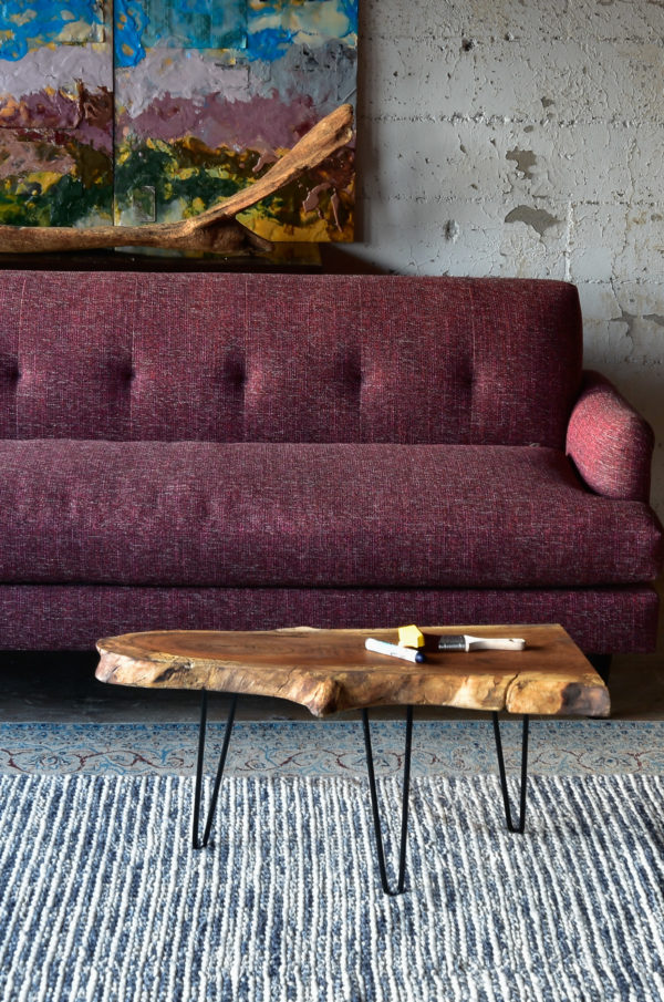 purple sofa and coffee table in living room