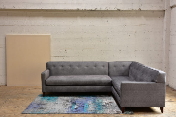 Grey sofa and patterned rug