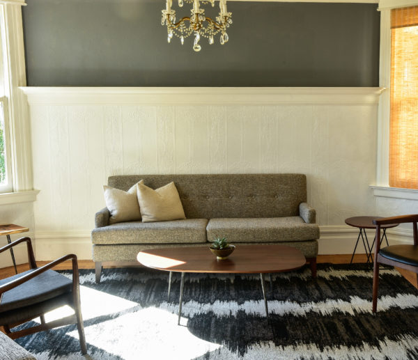 Grey sofa in living room with decor