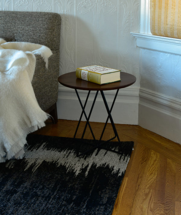 side table in bedroom with decor