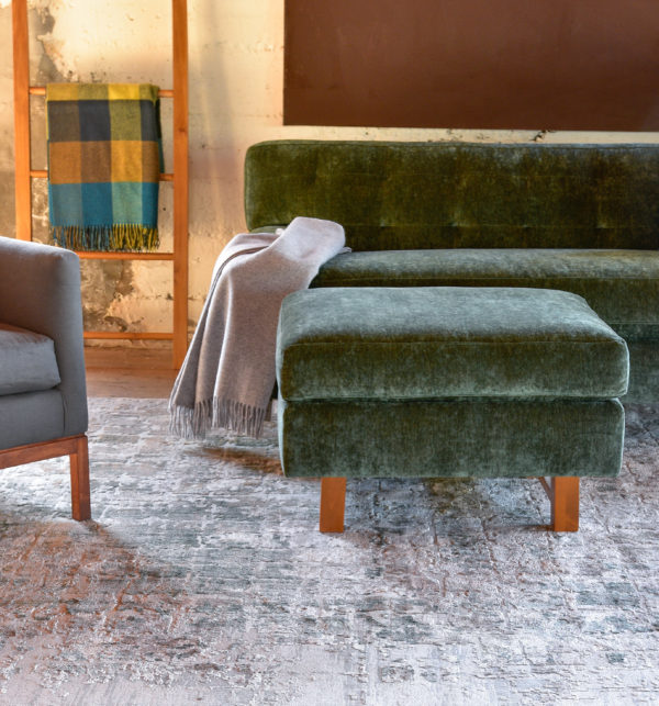 green velvet ottoman in living room