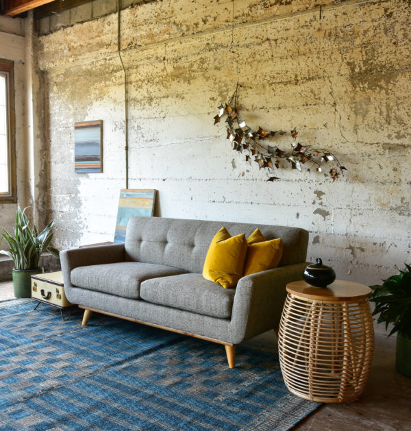 Grey sofa in living room with decor