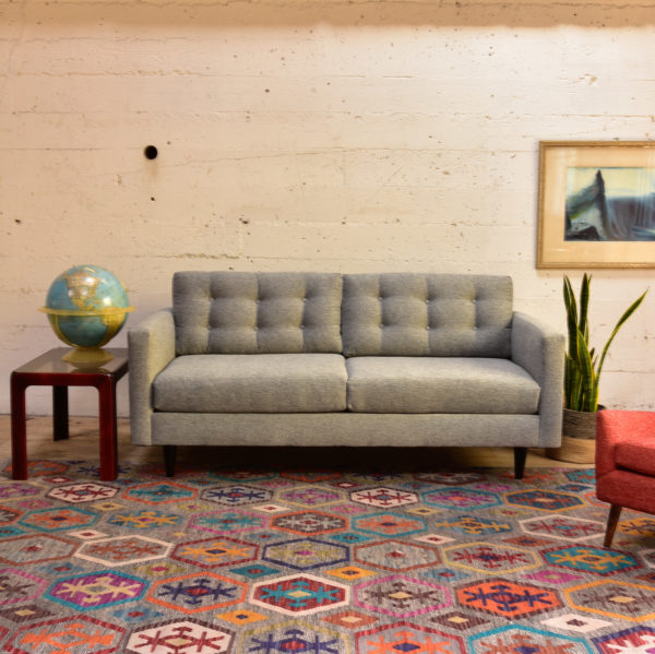 Grey sofa in living room with decor