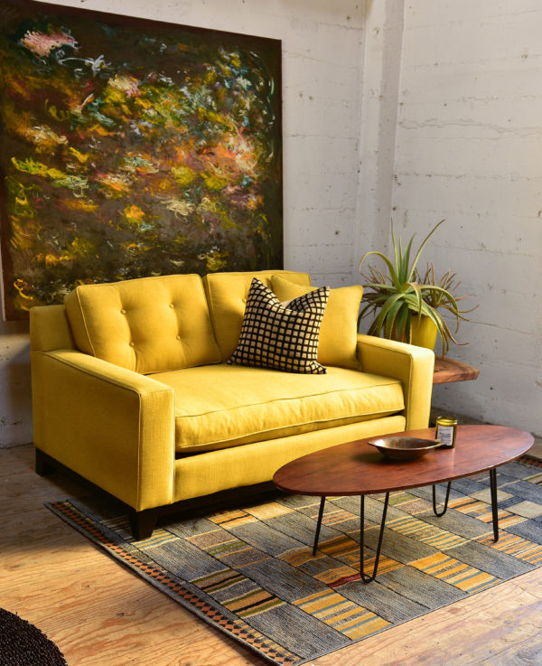 Yellow sofa in living room with decor