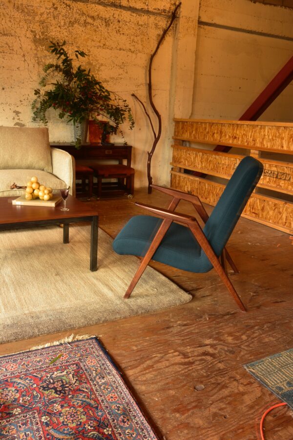 Blue mid century modern chair in living room