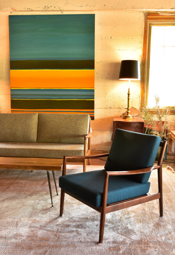 large colorful painting in a living room